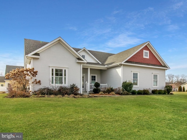 view of front of home with a front yard and a porch