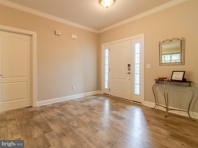 entrance foyer with crown molding and wood-type flooring