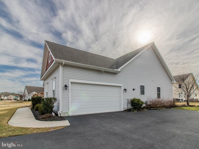 view of property exterior with a garage