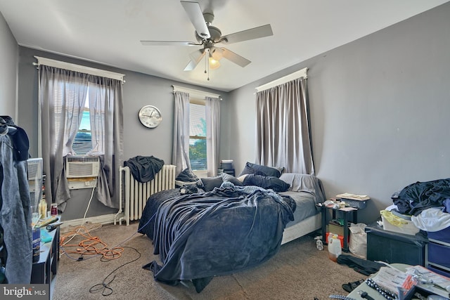 bedroom featuring cooling unit, radiator, carpet floors, and ceiling fan