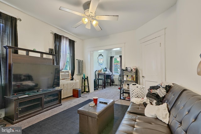 living room featuring ceiling fan, radiator, cooling unit, and dark carpet