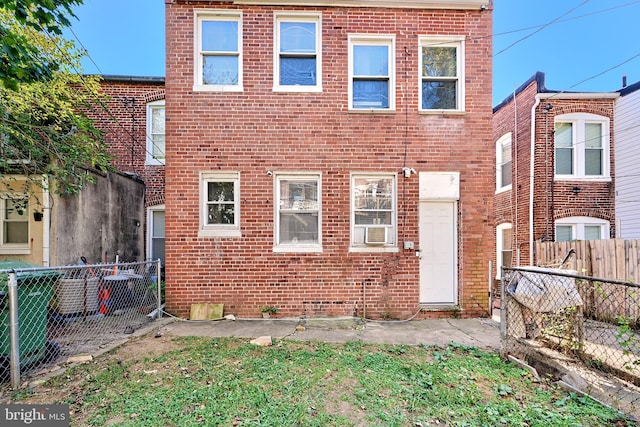 back of property featuring cooling unit