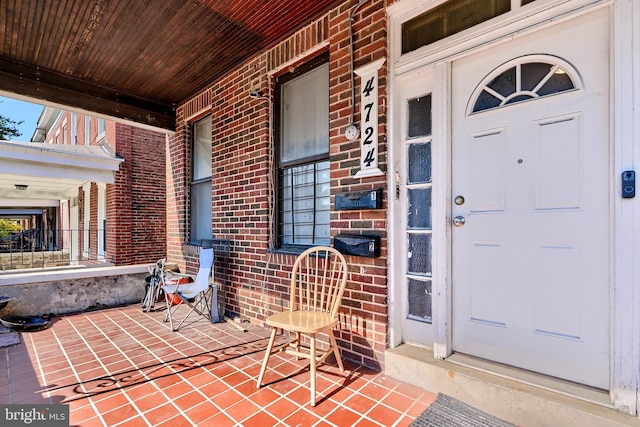 doorway to property with covered porch