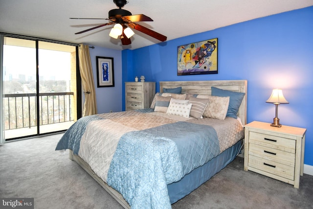 bedroom with ceiling fan, a wall of windows, access to exterior, and carpet