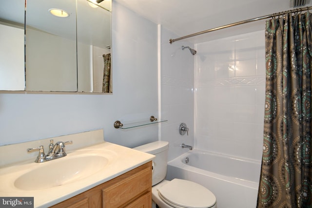 full bathroom featuring vanity, toilet, and shower / bath combo with shower curtain