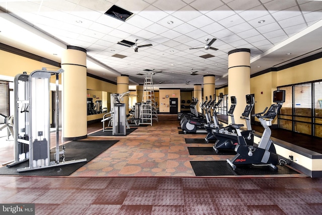 exercise room featuring a paneled ceiling