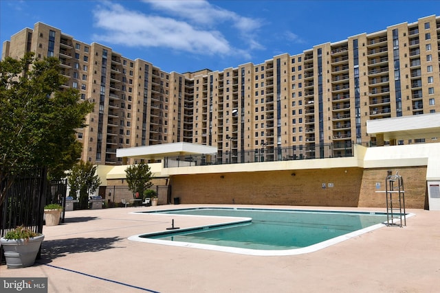 view of swimming pool featuring a patio area