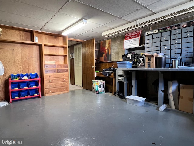 garage featuring wooden walls