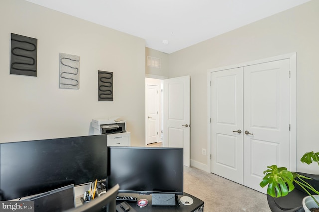 office area with light colored carpet