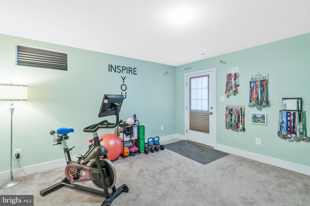 exercise room with carpet floors