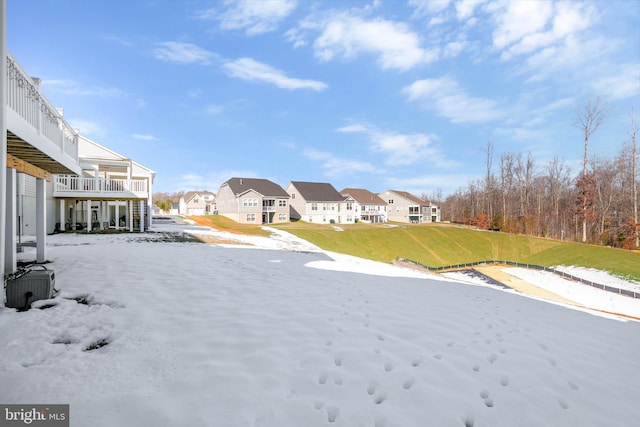 view of yard with a balcony