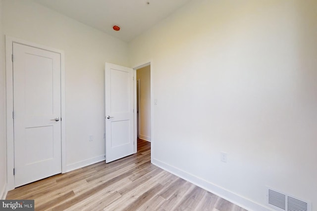 unfurnished bedroom with light wood-type flooring