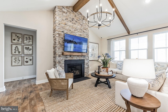 living room featuring high vaulted ceiling, a fireplace, hardwood / wood-style flooring, a notable chandelier, and beam ceiling