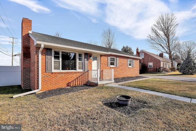 ranch-style home with a front yard