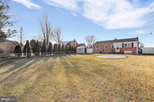 view of yard featuring a shed and a patio