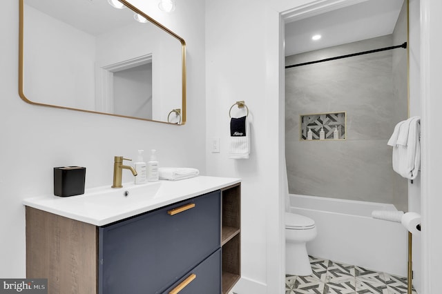 full bath featuring toilet, tile patterned floors, shower / tub combination, and vanity