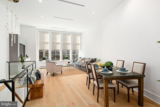 dining area with light hardwood / wood-style floors