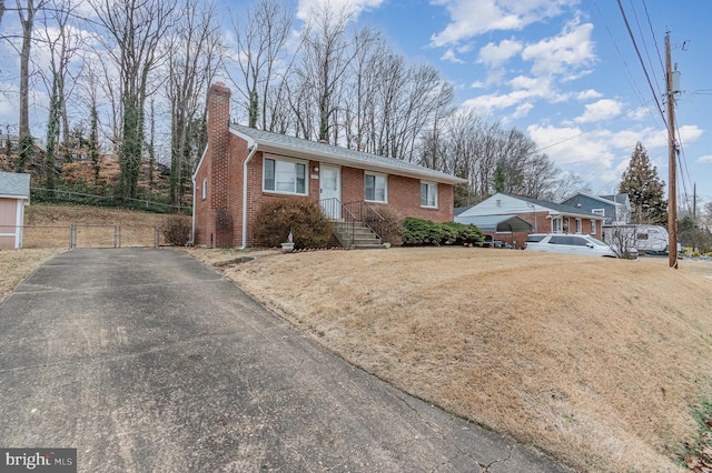 single story home with a carport and a front yard