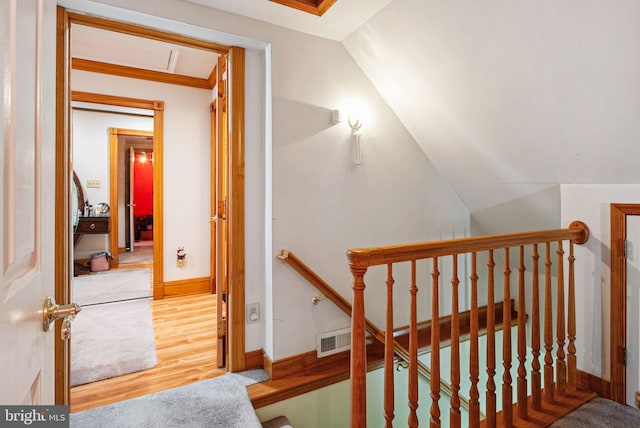 staircase featuring hardwood / wood-style floors