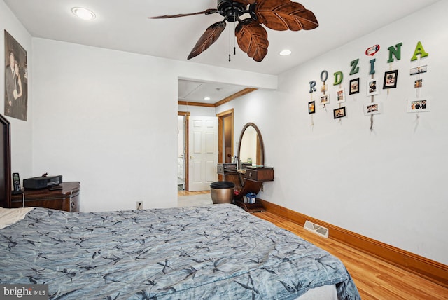 bedroom with ceiling fan and hardwood / wood-style floors