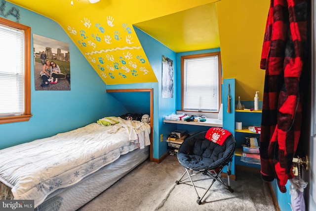 bedroom featuring multiple windows and carpet flooring