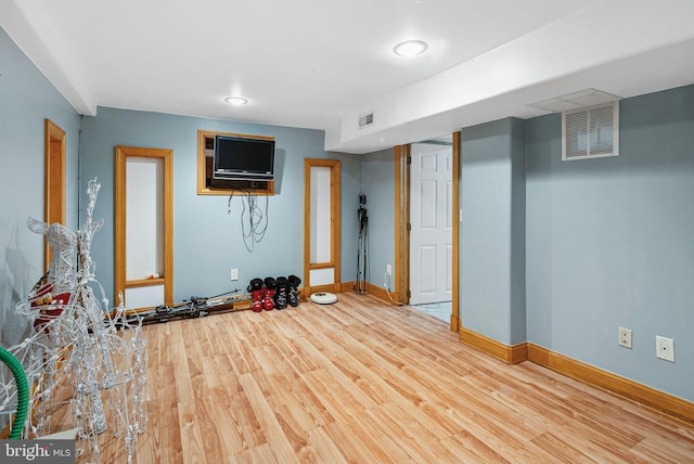 basement with wood-type flooring