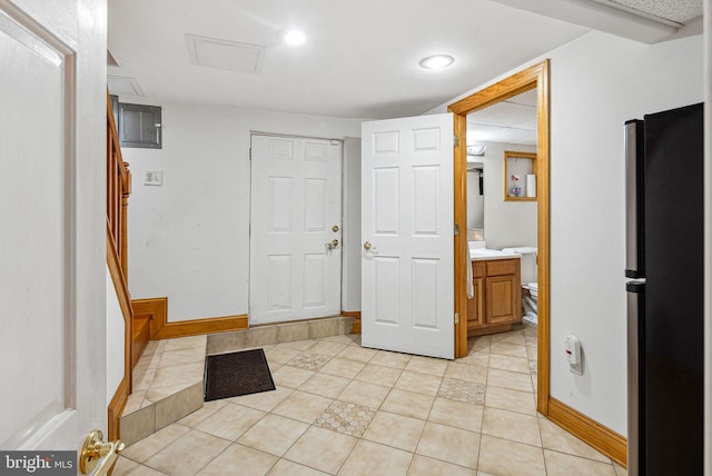 interior space with light tile patterned floors