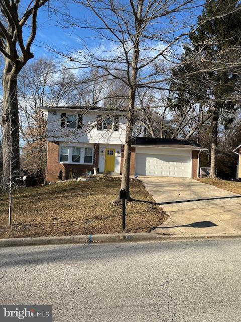 front of property with a garage