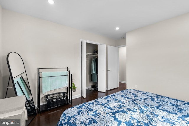 bedroom featuring a closet and dark hardwood / wood-style floors