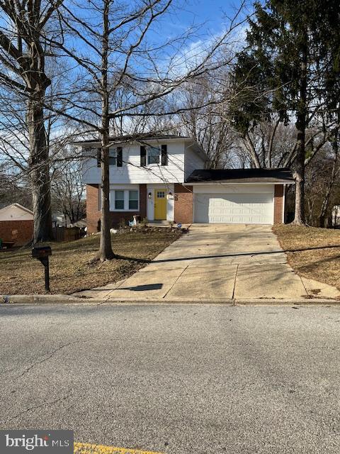 front facade with a garage