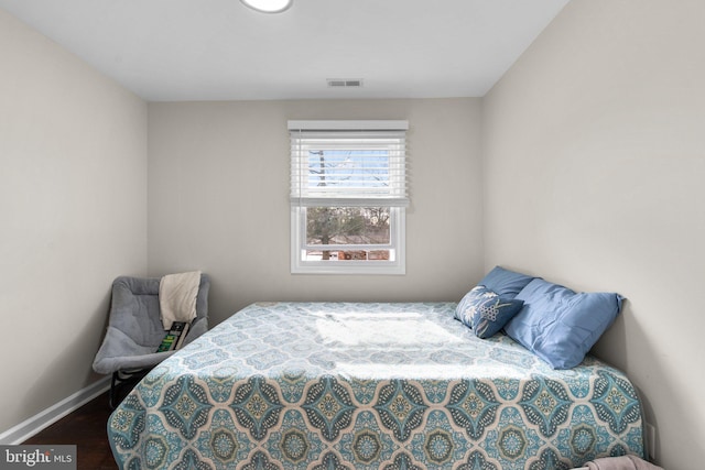 bedroom featuring wood-type flooring