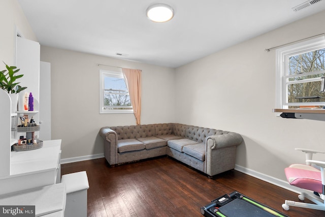 living room with dark hardwood / wood-style flooring