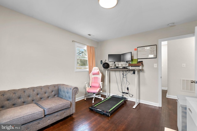 exercise area with dark wood-type flooring