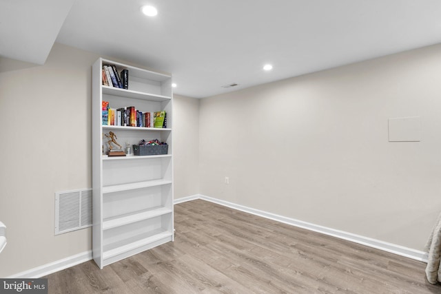 spare room featuring light hardwood / wood-style floors