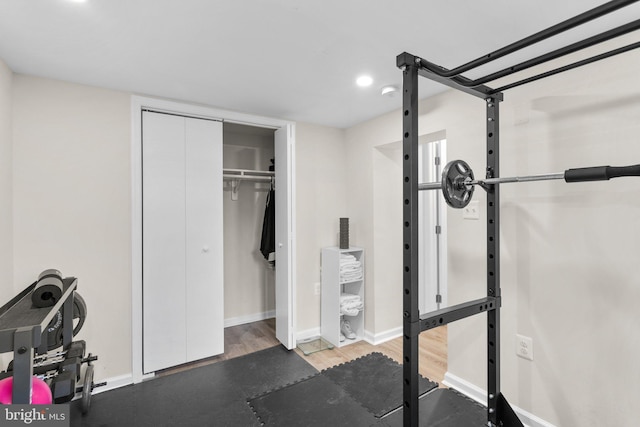 exercise area with dark wood-type flooring