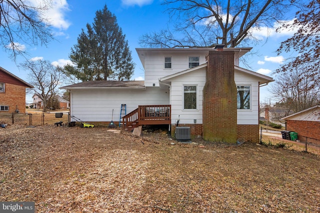 rear view of property with a deck and central air condition unit