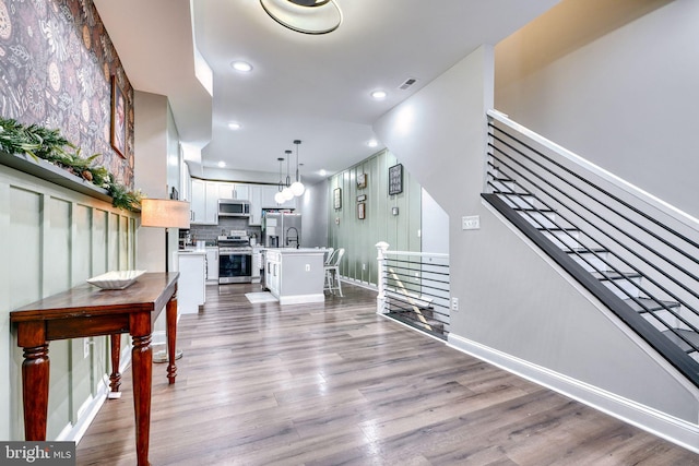 interior space featuring sink and hardwood / wood-style floors