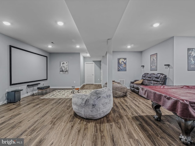 home theater room with hardwood / wood-style flooring and billiards