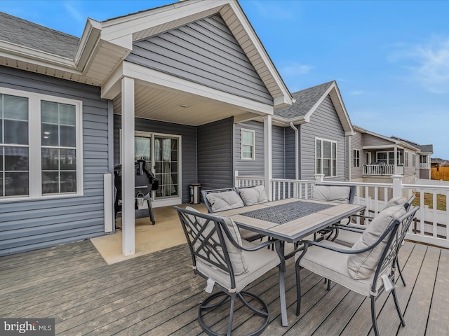 wooden deck featuring grilling area