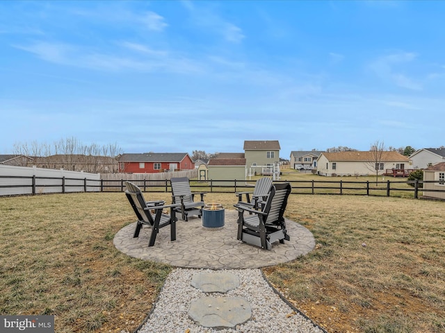 view of yard featuring a fire pit and a patio