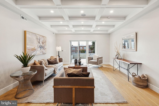 living room featuring coffered ceiling, beam ceiling, and light wood-type flooring