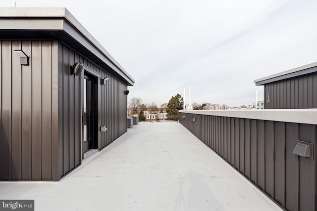 view of side of home featuring central AC