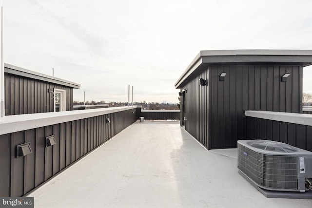 view of patio / terrace featuring central AC unit and a balcony