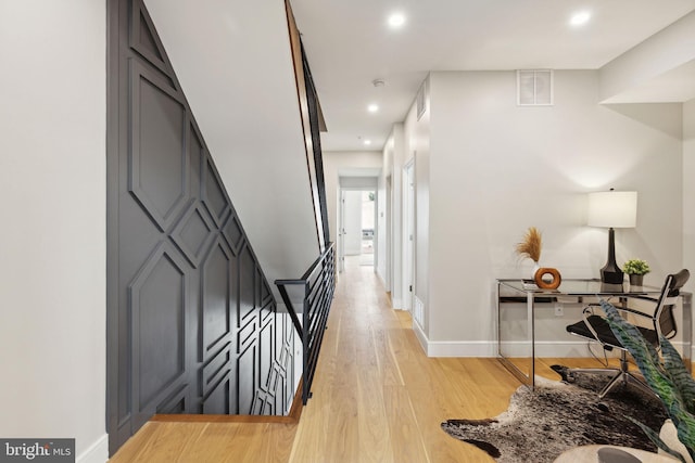 hallway with light wood-type flooring