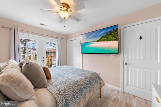 bedroom with a closet, light hardwood / wood-style flooring, access to outside, ceiling fan, and french doors