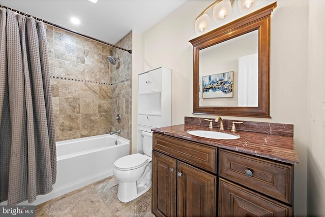 full bathroom with vanity, shower / tub combo, and toilet