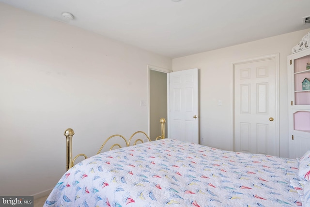 bedroom featuring visible vents