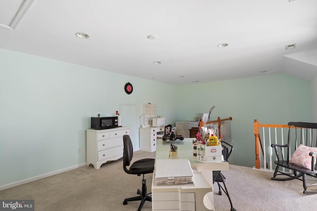 office space featuring baseboards, visible vents, vaulted ceiling, and carpet flooring