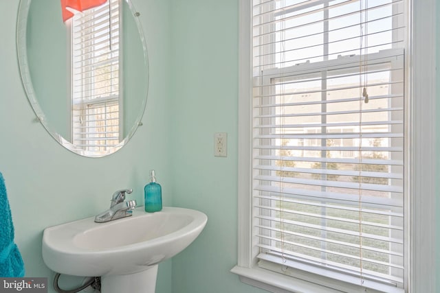 bathroom with a sink and a healthy amount of sunlight