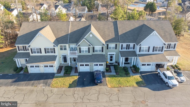 birds eye view of property with a residential view